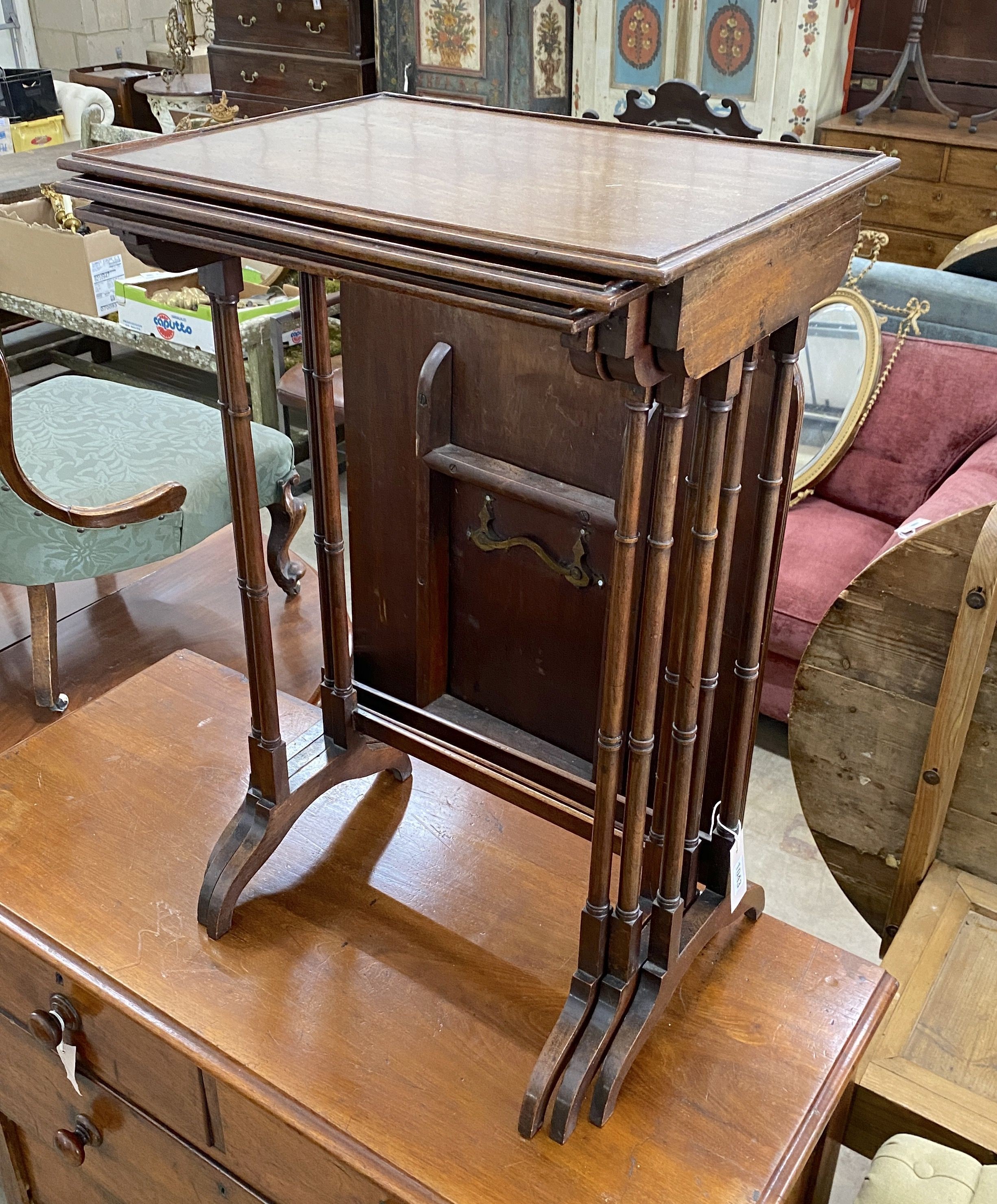 A nest of three Edwardian rectangular mahogany tea tables, width 50cm, depth 38cm, height 76cm